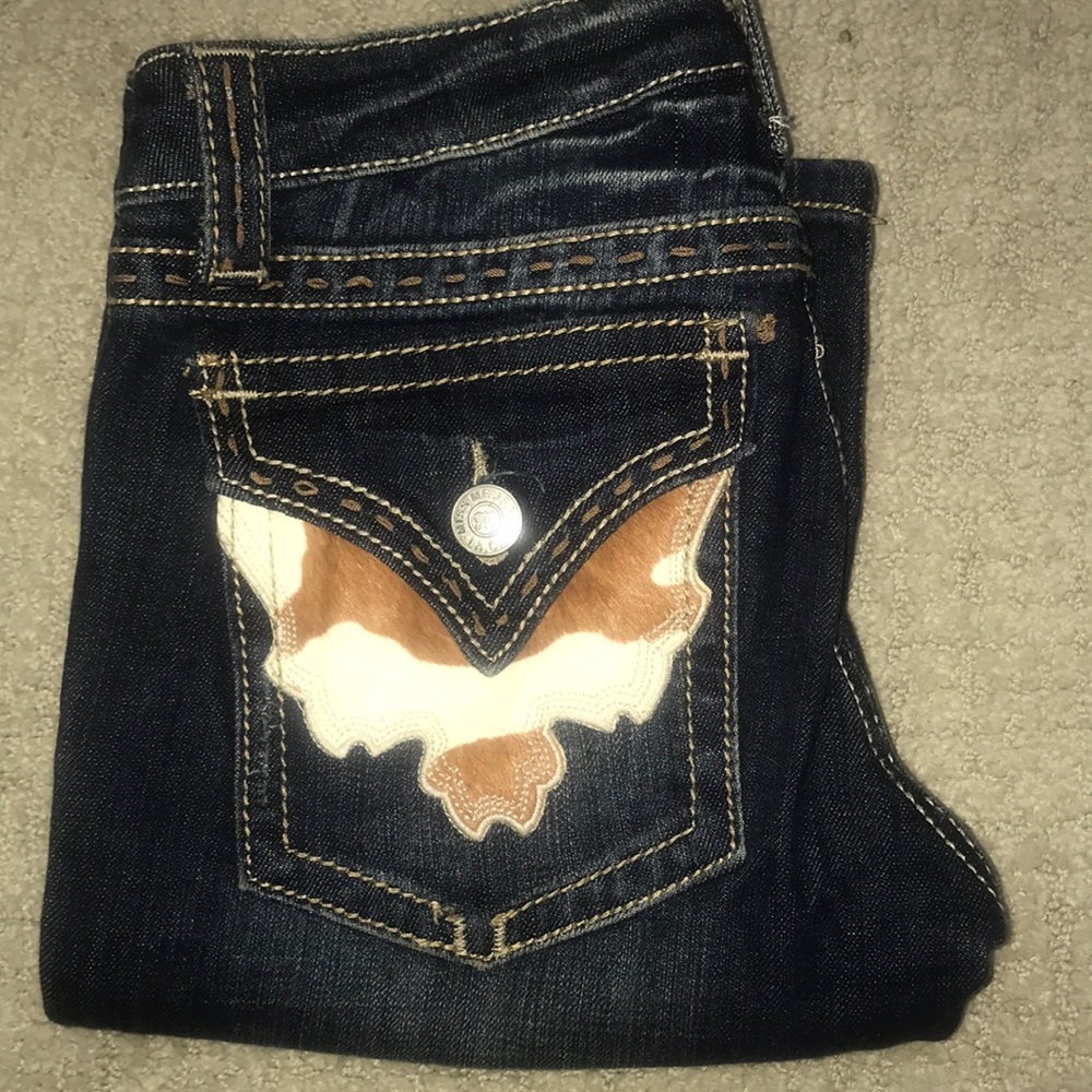 Cowhide pocket Miss Me boot jeans